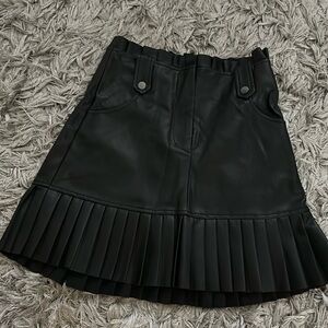 Black leather mini skirt